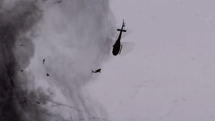 What Is a B-Movie? Definition & Film History 7 A shark-filled tornado approaches a helicopter in the sky, with sharks flying through the air.