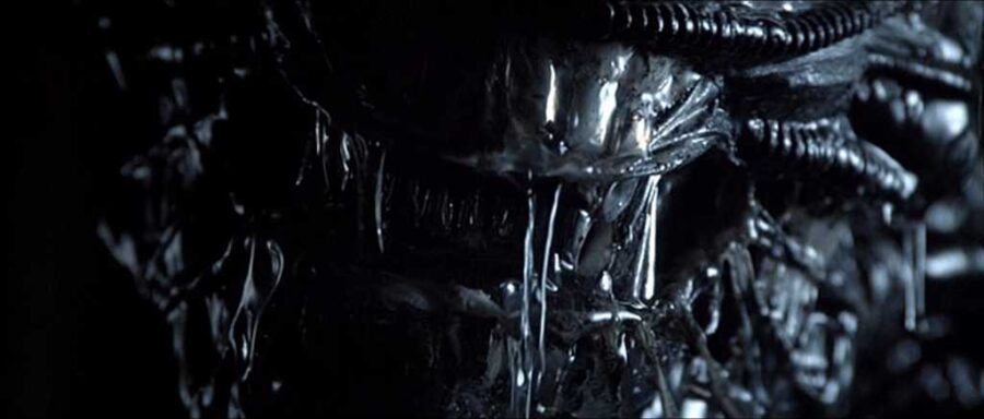 What Is Science Fiction? Definition & Film Origins Explained 9 Close-up of the Xenomorph’s dripping, biomechanical face from Alien