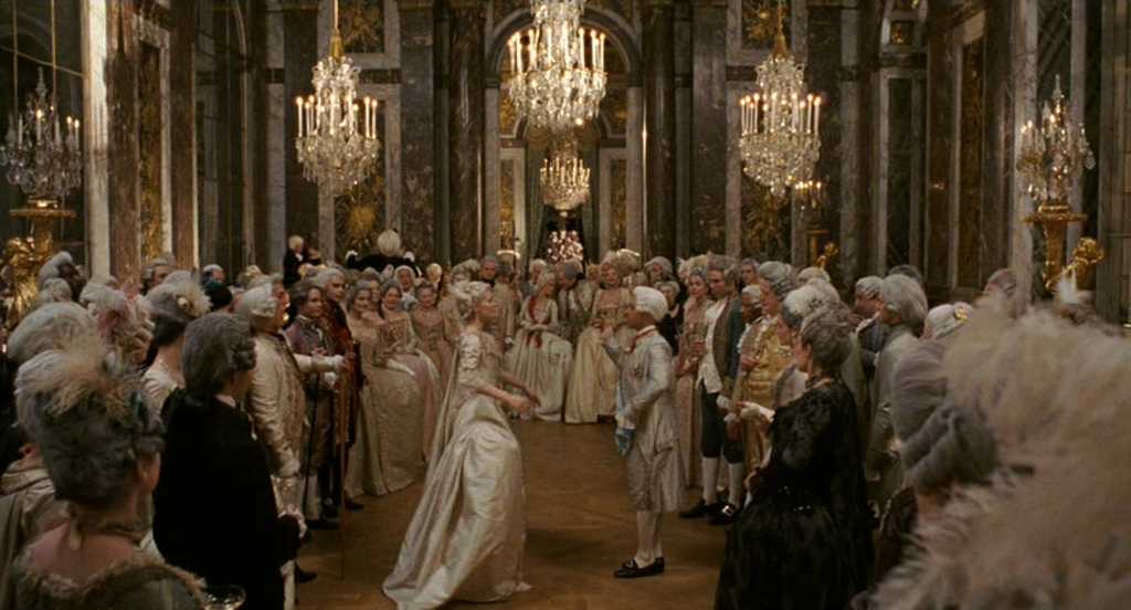What Is a Period Piece? Definition & Meaning in Film 5 A lavish ballroom filled with nobles in powdered wigs and silk gowns