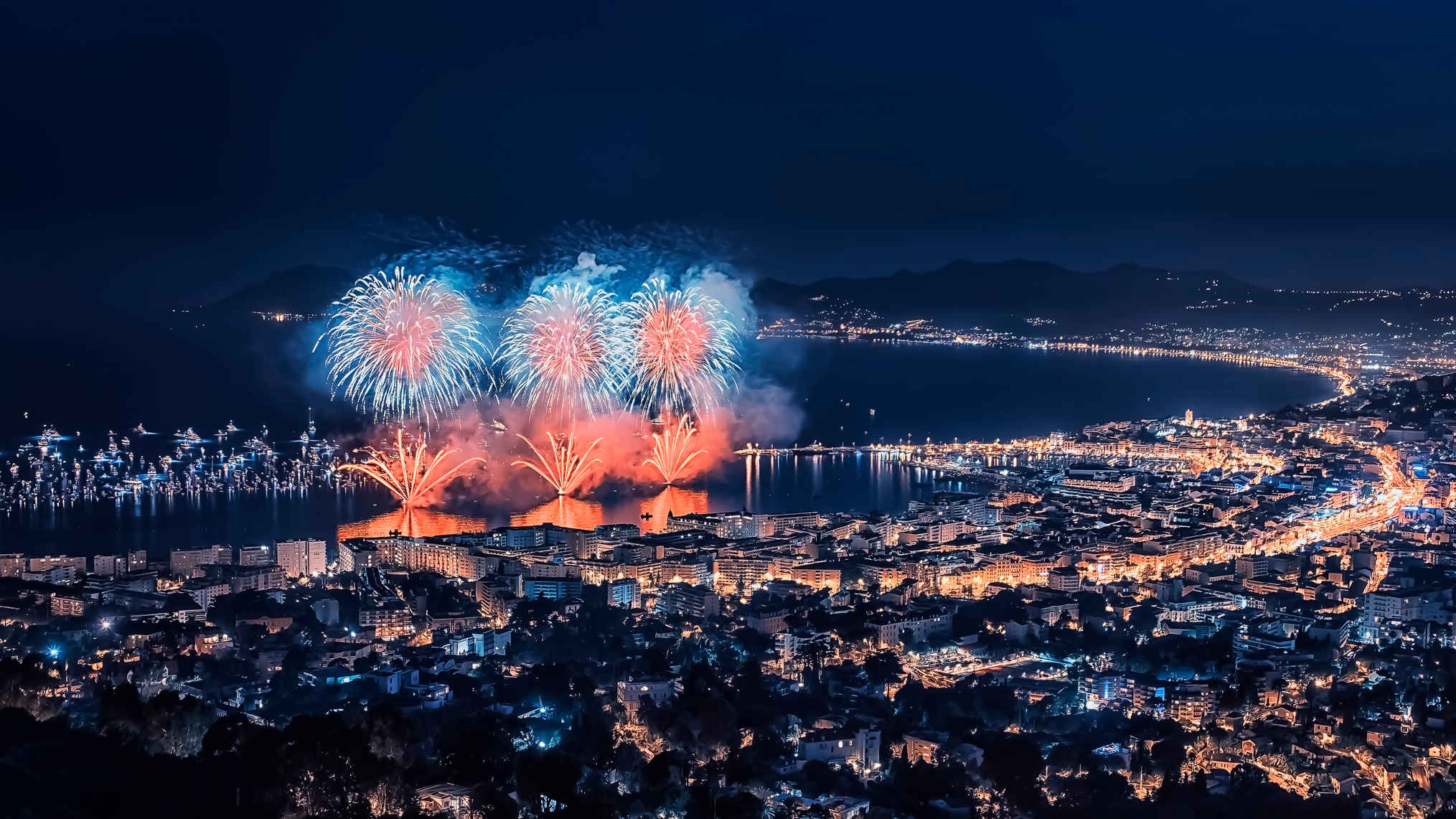 What Does a Movie Critic Do? Job & Career Guide 3 Aerial view of fireworks lighting up the Cannes waterfront during the film festival