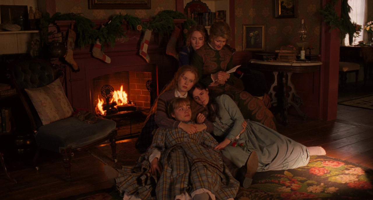 What is Set Design in Film? Definition & Process 4 Little Women (2019) still – March family gathered by the fireplace in a warmly lit Victorian parlor