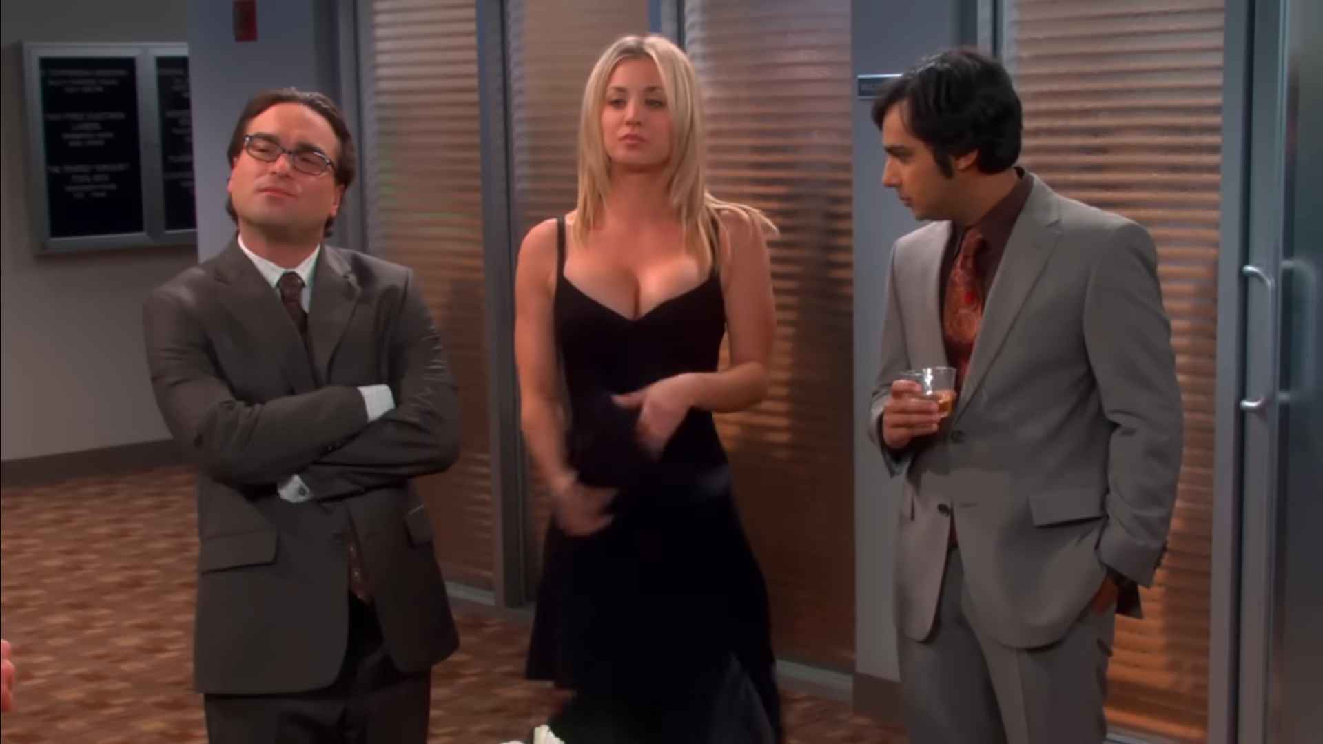What Is a Sitcom? Definition, Structure & Examples 2 Scene from The Big Bang Theory showing Leonard Hofstadter, Penny, and Raj Koothrappali standing together, representing the Everyman, Lovable Fool, and Neurotic Worrier sitcom archetypes.
