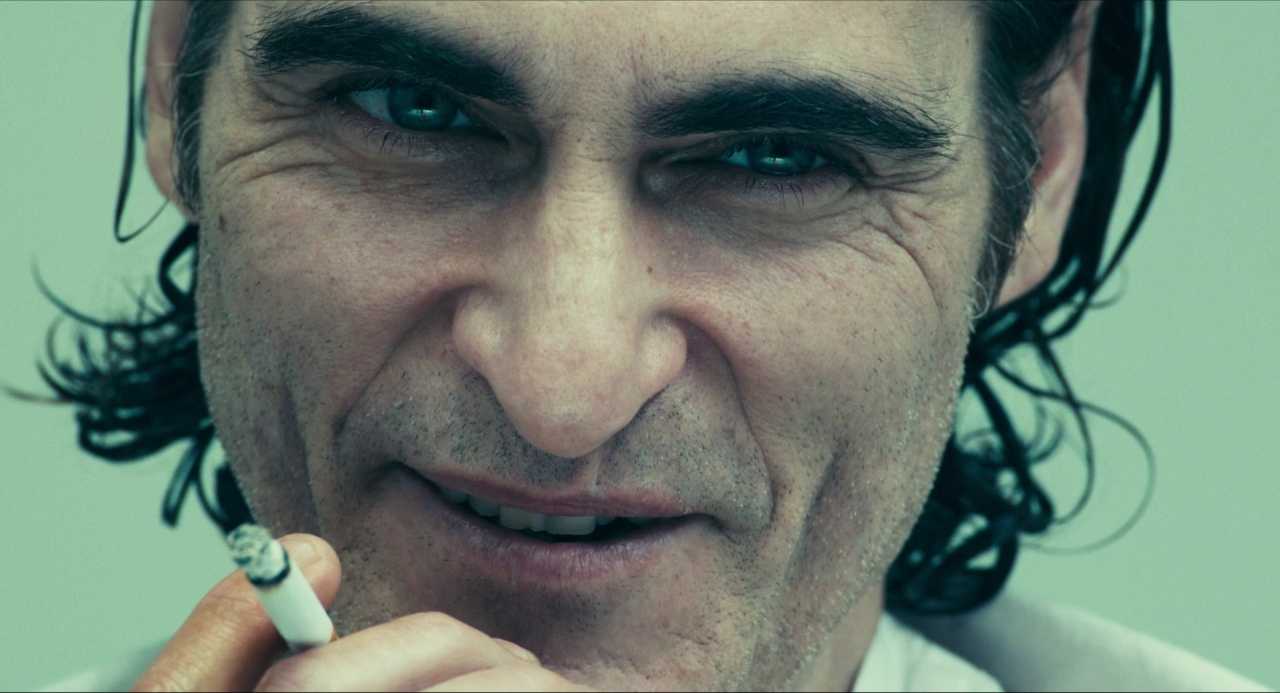 What Does a Cinematographer Do? Job Description & Real DP Examples 8 Extreme close-up of Arthur Fleck smiling with a cigarette in Joker