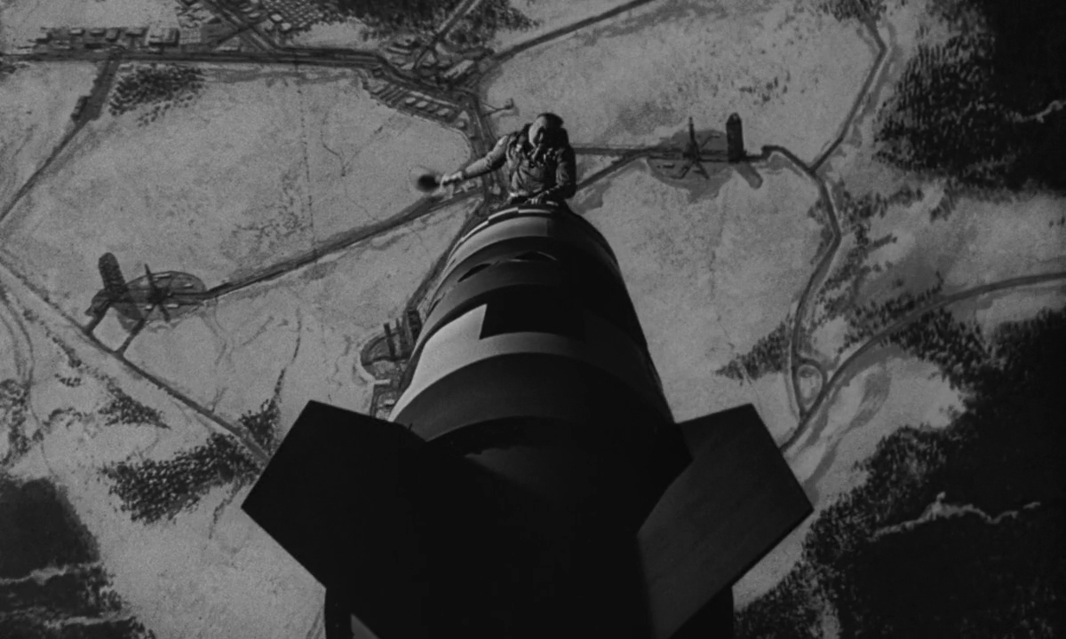 Historical Irony in Film: From Real Events to the Silver Screen 2 Major Kong rides a nuclear bomb as it falls in Dr. Strangelove (1964), symbolizing the film's satirical take on Cold War logic.