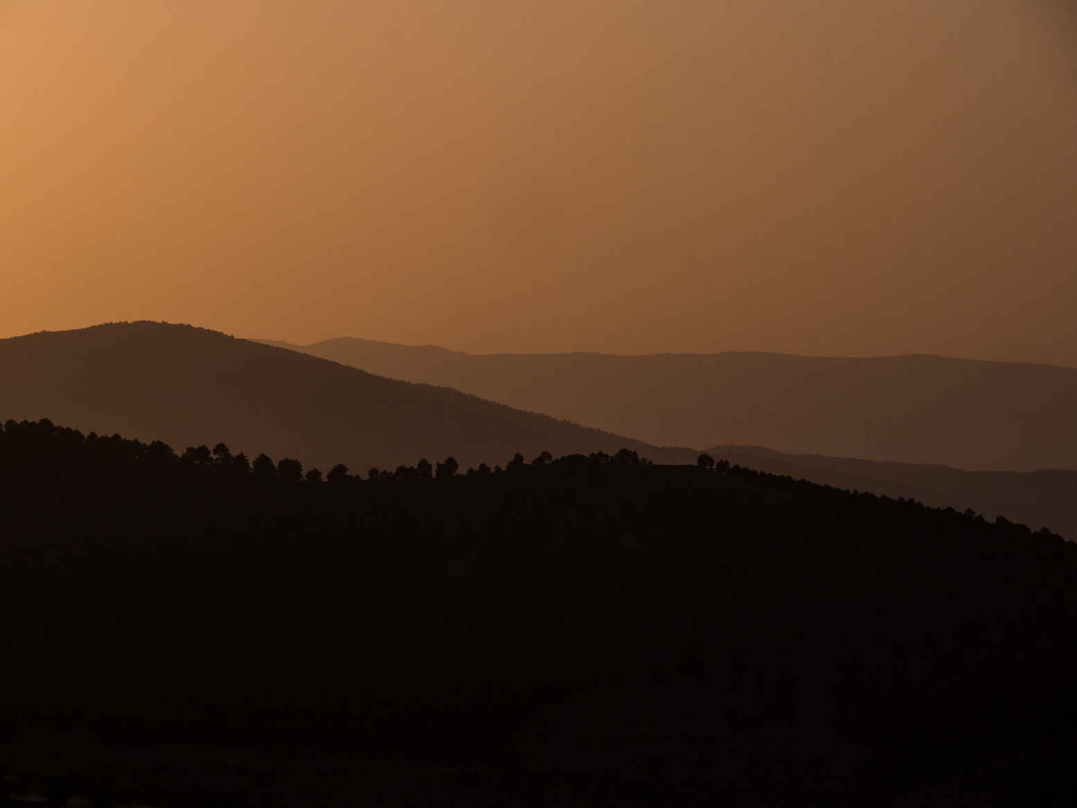 Types of Photography: Genres, Styles & Techniques Explained 11 Layers of mountain ridges in Sierra Nevada, Andalusia, captured at sunset with warm tones