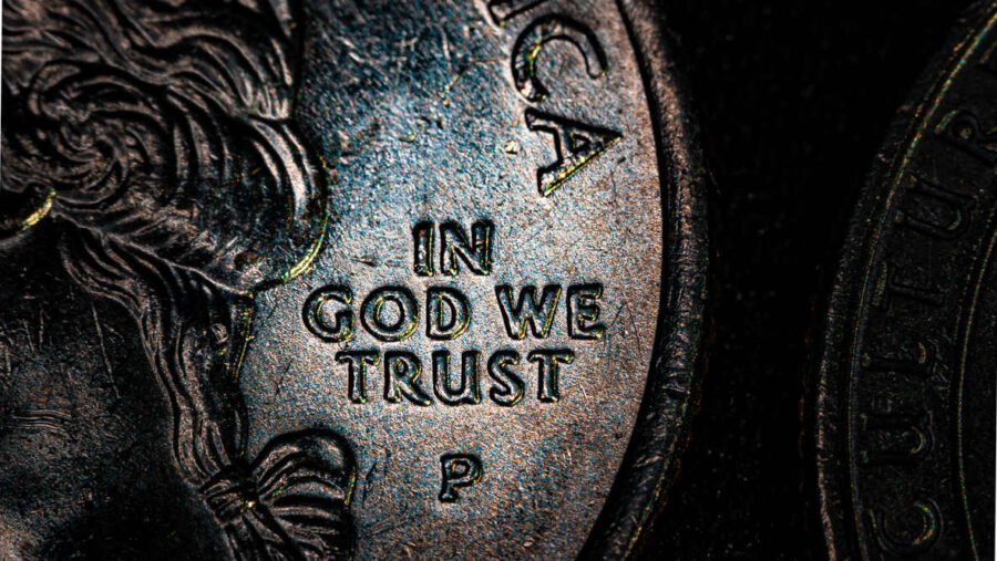 What Is Macro Photography? Definition, Gear & Techniques 10 Macro photo of the phrase “In God We Trust” on a U.S. coin with visible surface texture.