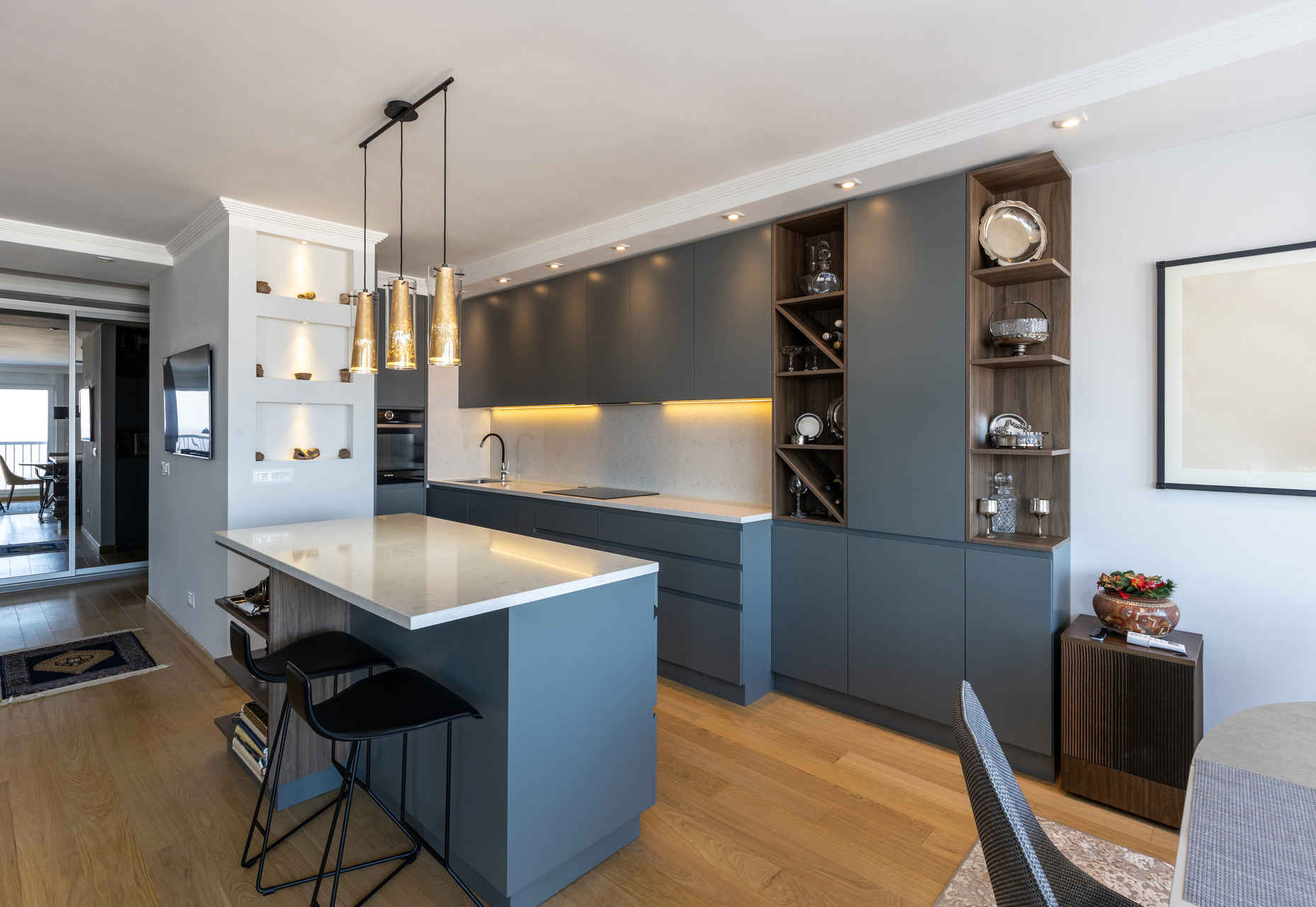 Types of Photography: Genres, Styles & Techniques Explained 14 Bright modern kitchen with island, pendant lights, and built-in cabinets
