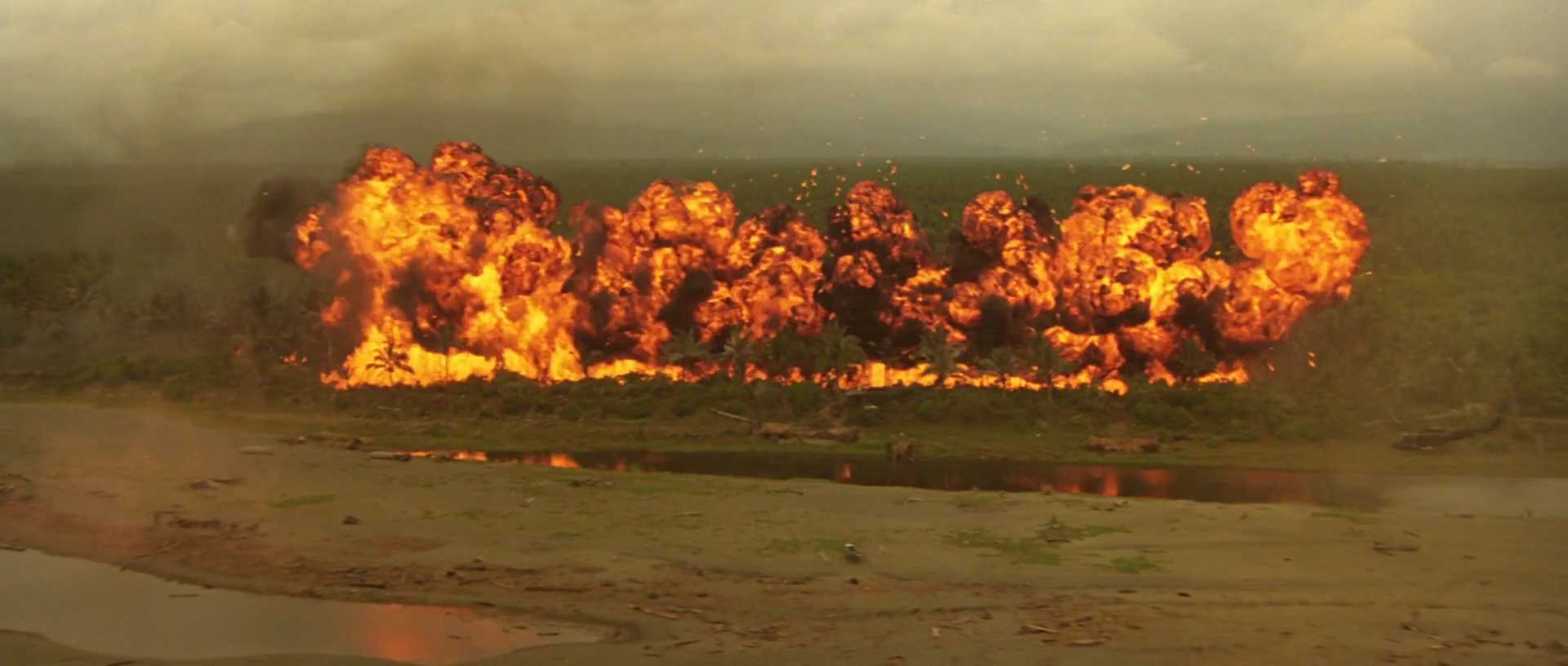20 Movie Themes for Screenwriters to Explore 15 A massive line of fire explodes across a jungle landscape during a napalm strike.
