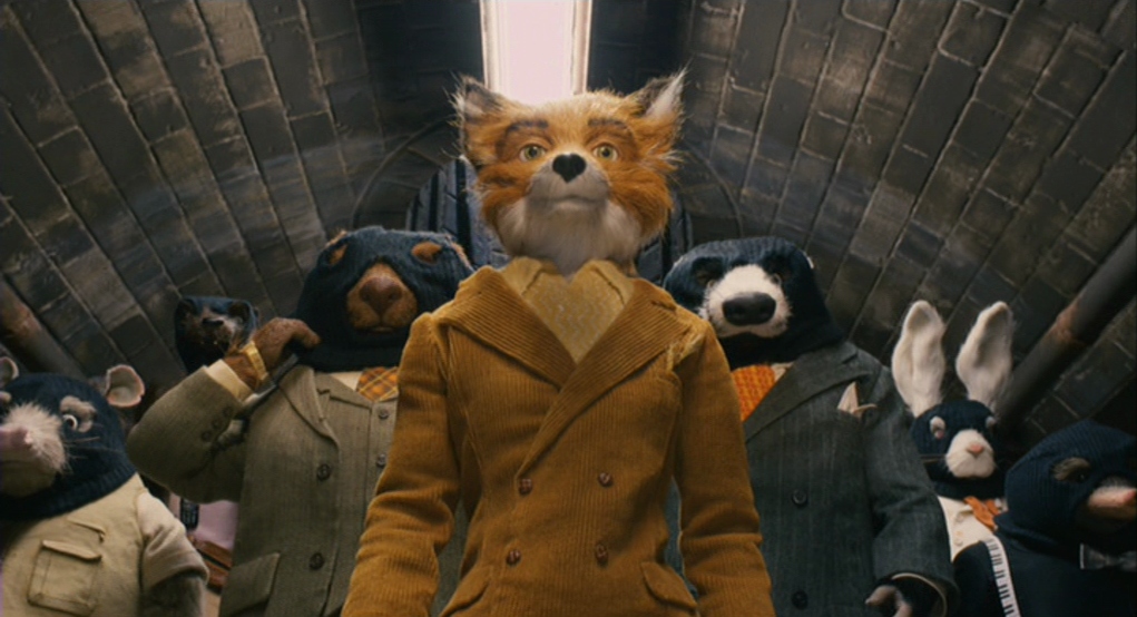 What is a Medium Shot (MS)? Definition and Examples 5 Mr. Fox stands in front of his crew inside a tunnel, framed from the waist up, looking upward with serious faces.