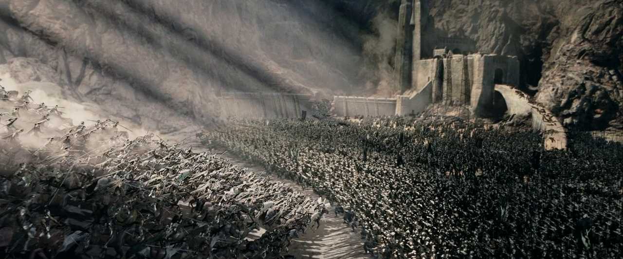 What is an Epic Poem? Definition & Key Features 3 Thousands of soldiers charge toward a fortified stone keep during a large-scale battle, with beams of light breaking through the clouds above.