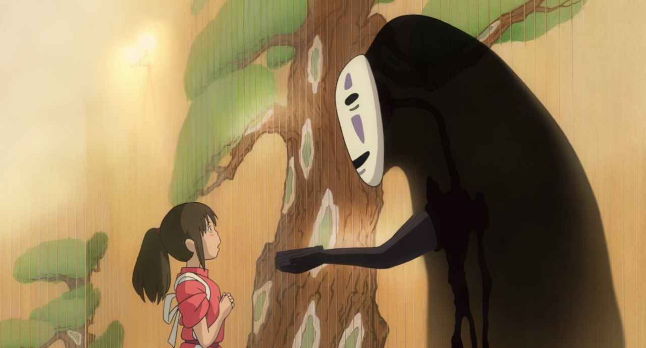 The Damsel in Distress Trope Explored: From Fairy Tales to Modern Movies 9 Chihiro stands nervously before the spirit No-Face, who extends a hand toward her in a quiet moment.