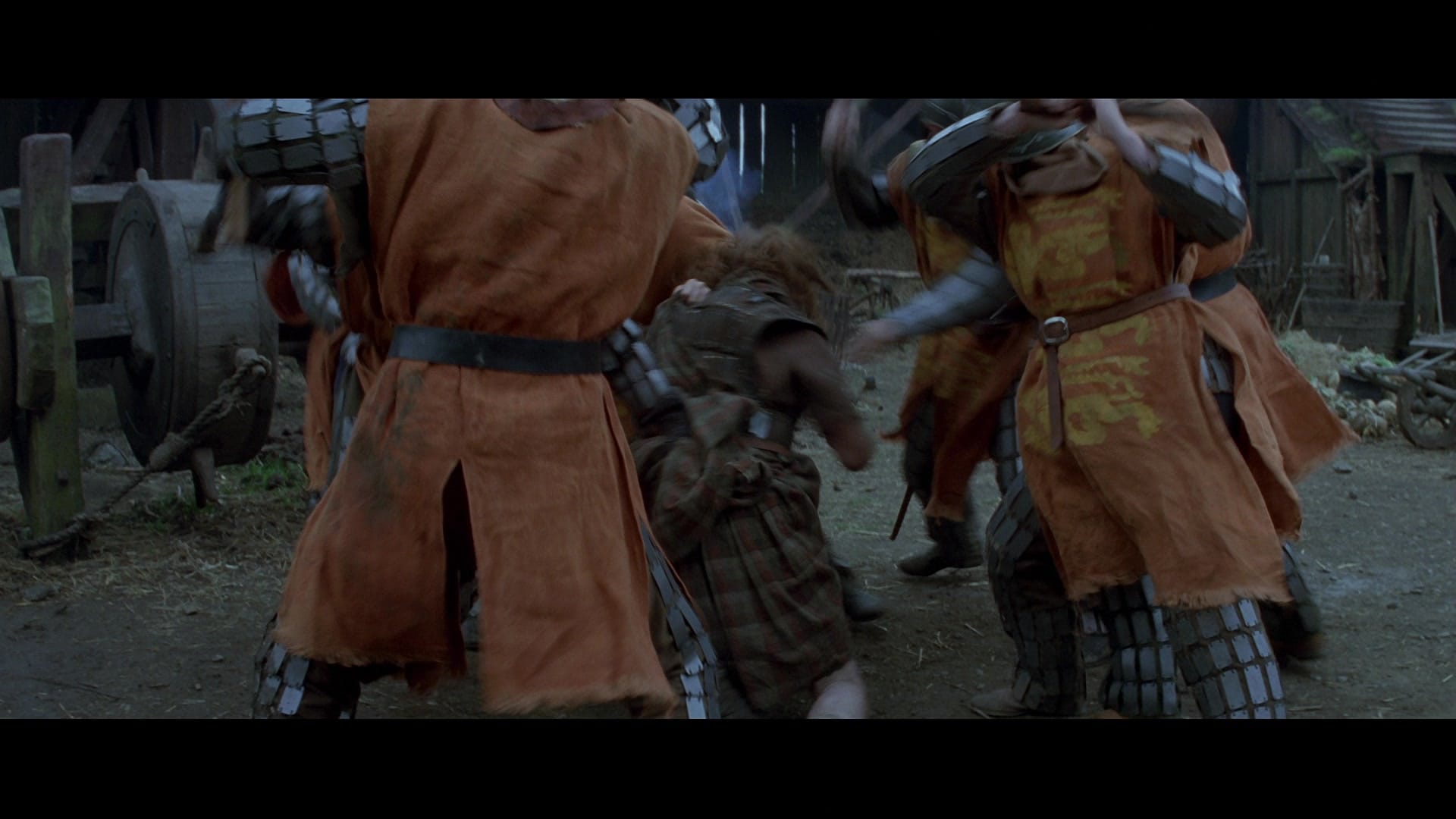20 Movie Themes for Screenwriters to Explore 20 William Wallace is tackled and surrounded by armored men in orange tunics during a chaotic ambush.