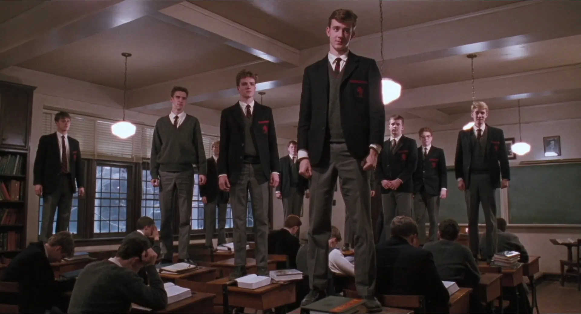 What Is Lyric Poetry? Definition & Examples Explained 3 Students in school uniforms stand on desks in a classroom, facing their teacher in Dead Poets Society.