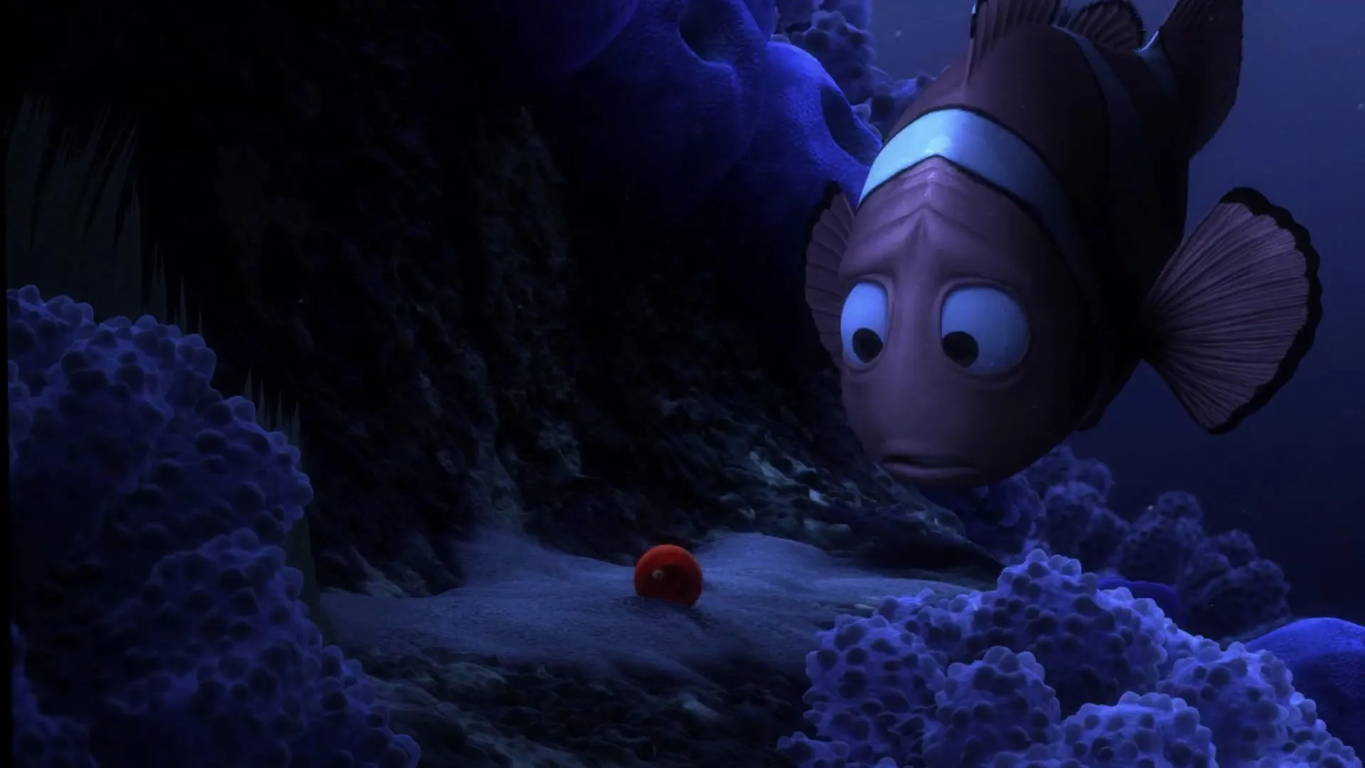 Sympathy in Stories: How It Helps You Connect to Characters 2 Marlin stares sadly at a lone red egg on the ocean floor, surrounded by dark coral.
