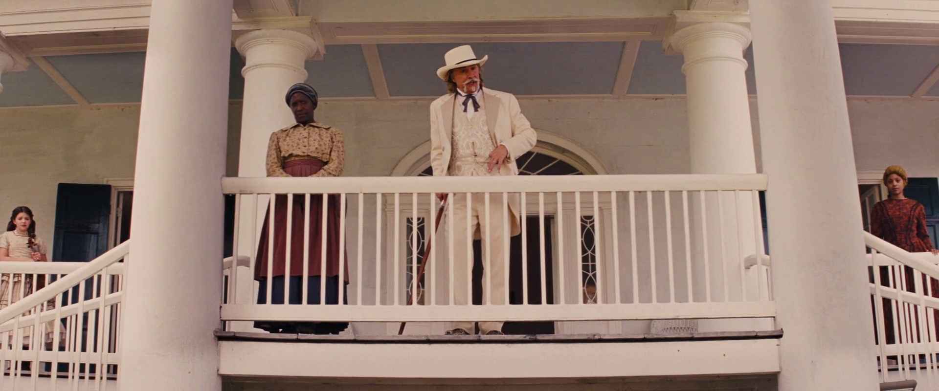Settings Ideas and Examples for Film Scenes 17 A white plantation owner stands on a large porch flanked by enslaved women, framed by white pillars