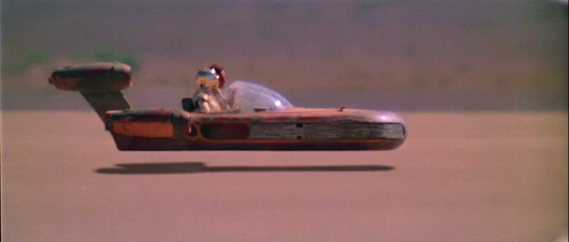 What Is a Color Scheme? Definition & Uses Explained 10 Luke Skywalker pilots a red landspeeder across the orange desert landscape of Tatooine in bright daylight.