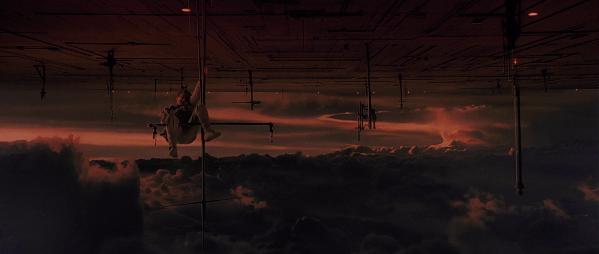What is The Hero’s Journey? Story Structure Explained with Star Wars 11 Luke Skywalker hangs from a narrow pole beneath Cloud City at sunset, surrounded by dark clouds after being defeated by Darth Vader.