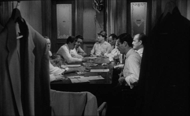 Settings Ideas and Examples for Film Scenes 15 A dozen men sit around a long table in a cramped jury room, shot in black and white