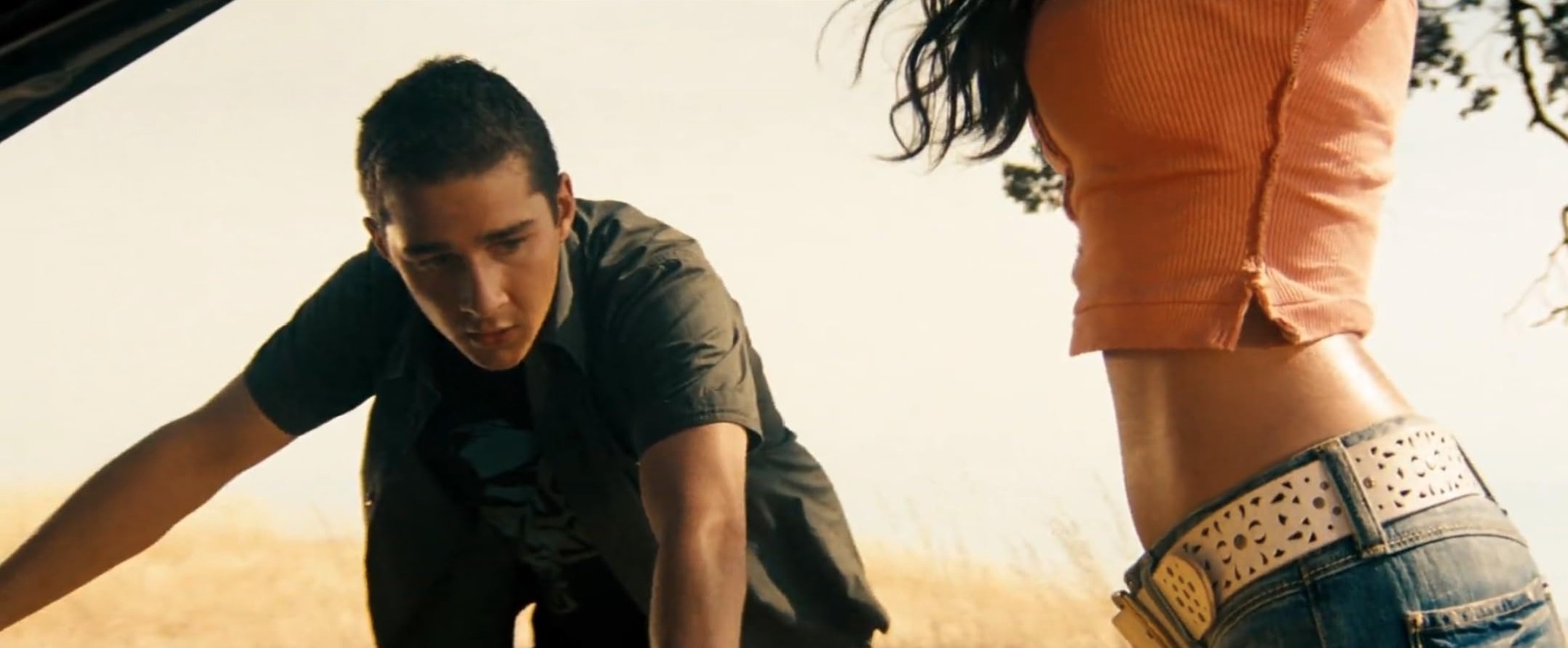 What Is the Male Gaze in Film? Definition +How Movies Use It 2 Megan Fox’s midriff and jeans while Shia LaBeouf leans over a car, looking toward her in an open field