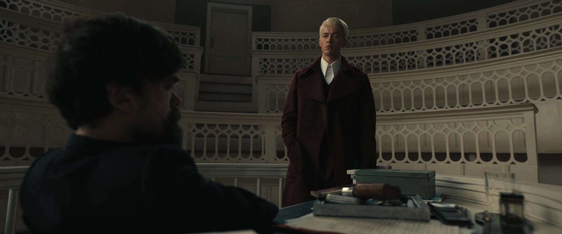 Origin Stories in Film: Types, Structure, and Meaning 6 Coriolanus Snow stands silently in an amphitheater classroom while Dean Highbottom, seated in shadow, confesses the Games’ origins.