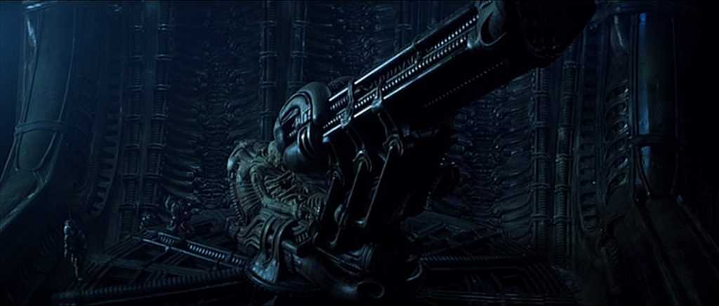 Settings Ideas and Examples for Film Scenes 19 Dark, biomechanical alien cockpit with twisted structures and a large mounted device in an eerie blue light