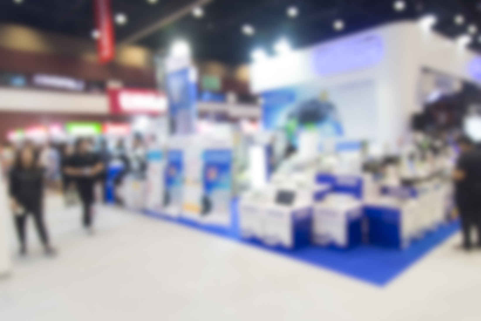 What Is a Model Release Form? Definition, Uses (+Free Template) 7 Blurred photo of a convention booth