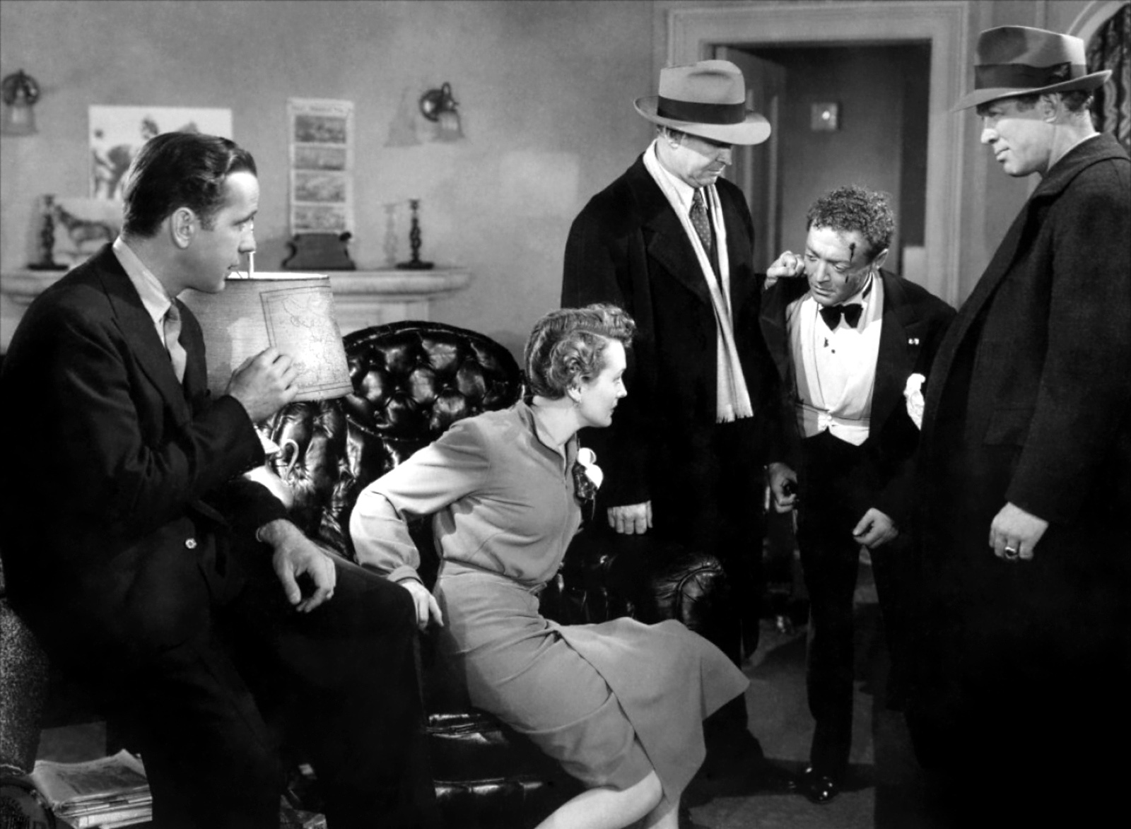 What Is a Unit Still Photographer? Definition and Job Description 3 Promotional still from The Maltese Falcon (1941) showing O'Shaughnessy and Cairo clashing in front of the police