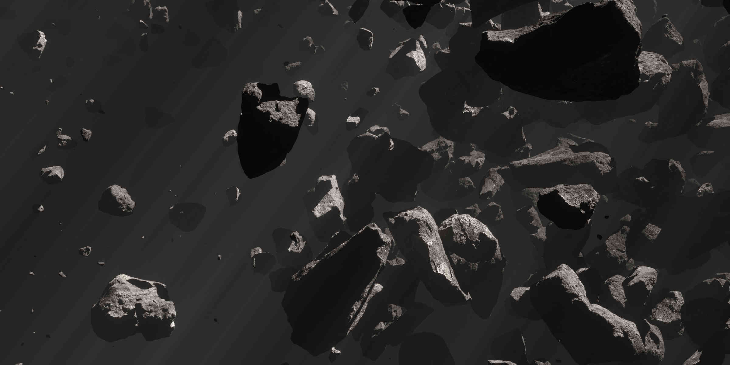 Volumetric Lighting Explained: Definition and On-Set Control 3 Dark asteroids floating in space with angled light beams visible through dusty haze.
