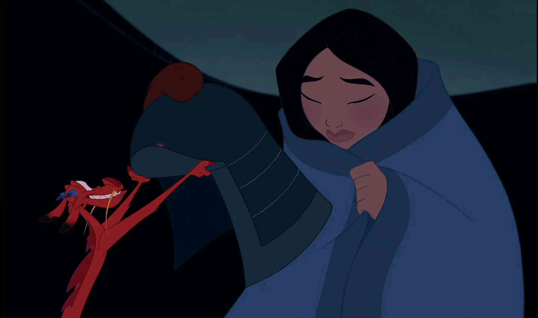 What is a Legend? Definition, Meaning, and Film Examples 5 Mulan sits wrapped in a blue blanket with her eyes closed while Mushu, a small red dragon, holds up a soldier’s helmet beside her.