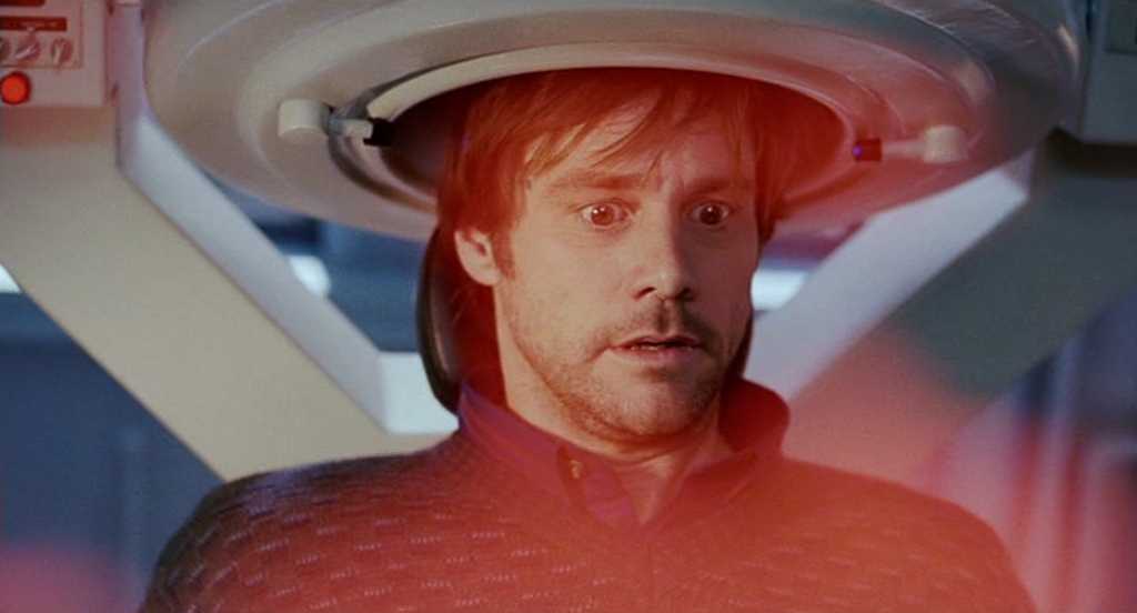 Post-Structuralism in Film Studies: A Complete Guide 5 A close-up of Joel sitting in a chair with a circular medical device around his head. A red light flares across the frame as he stares ahead, tense and wide-eyed.