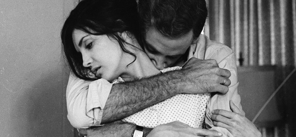 Third Cinema: Definition, Theory, and Key Examples 5 Black-and-white close-up of Elena looking off to the left while Sergio embraces her from behind, his face near her neck and his arms wrapped around her shoulders.
