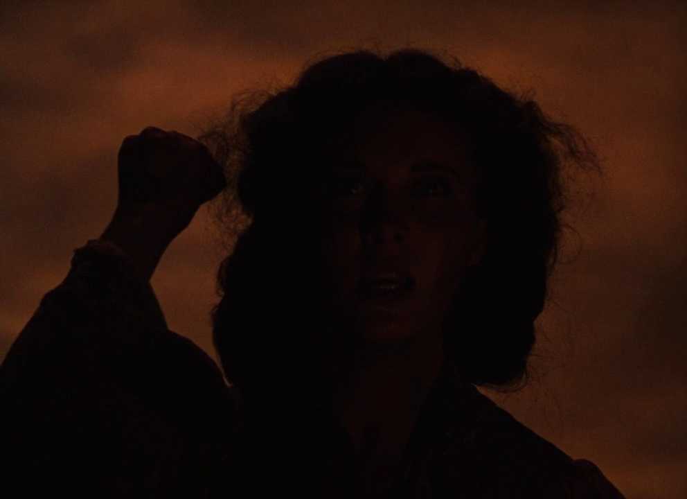 100+ Best Movie Quotes of All Time: The Definitive List 13 Vivien Leigh as Scarlett O'Hara silhouetted with raised fist against a fiery sky in Gone with the Wind (1939)